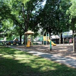 Scott Park Playground With Slides, Swings, And Small Rock Climbing Wall