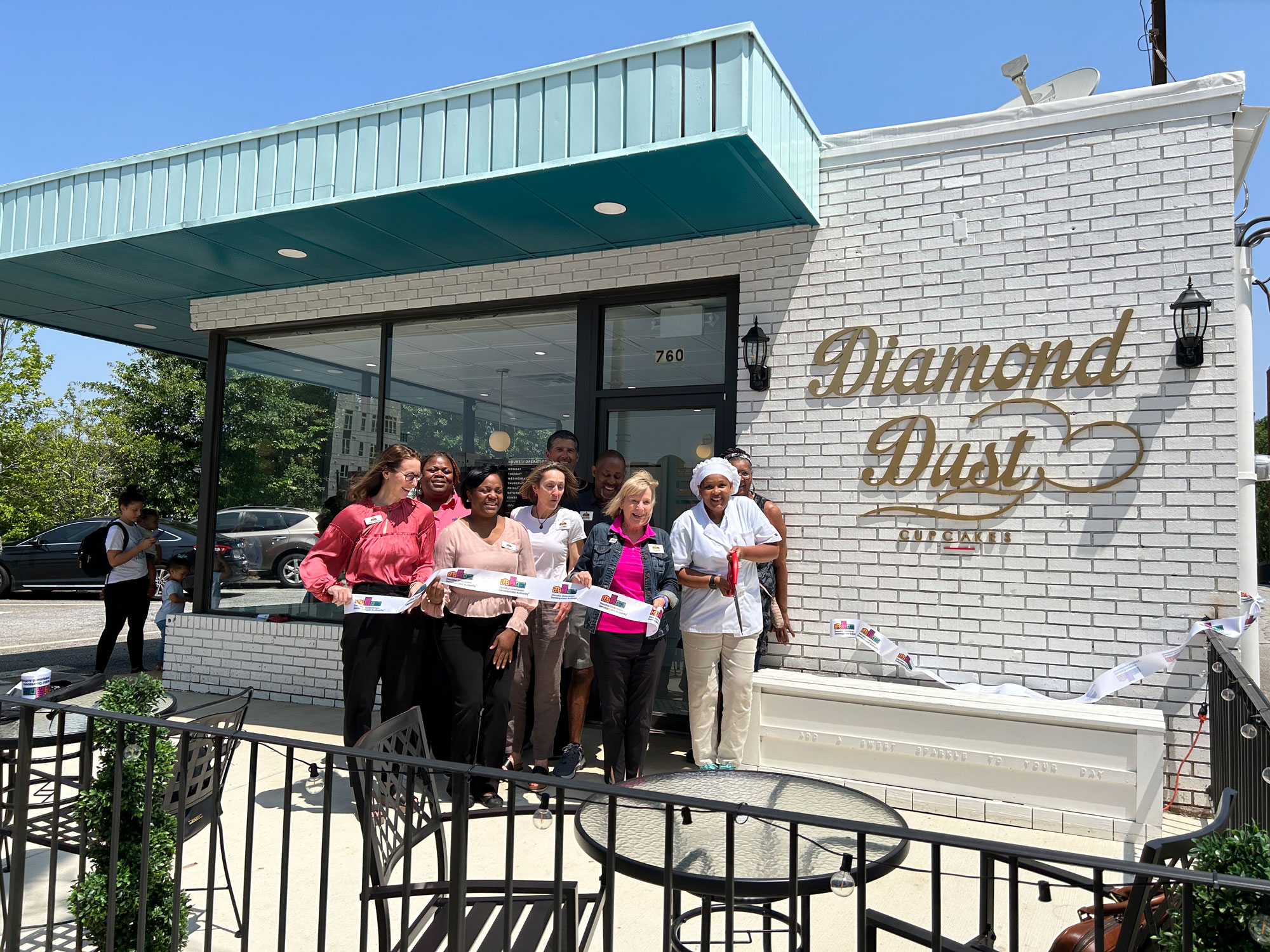 ribbon cutting outside Diamond Dust