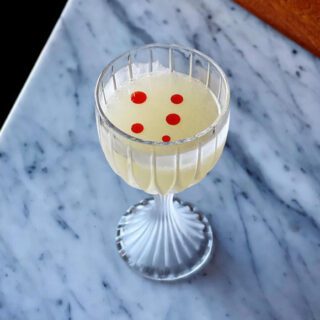 Cocktail on marble table at Kimball House