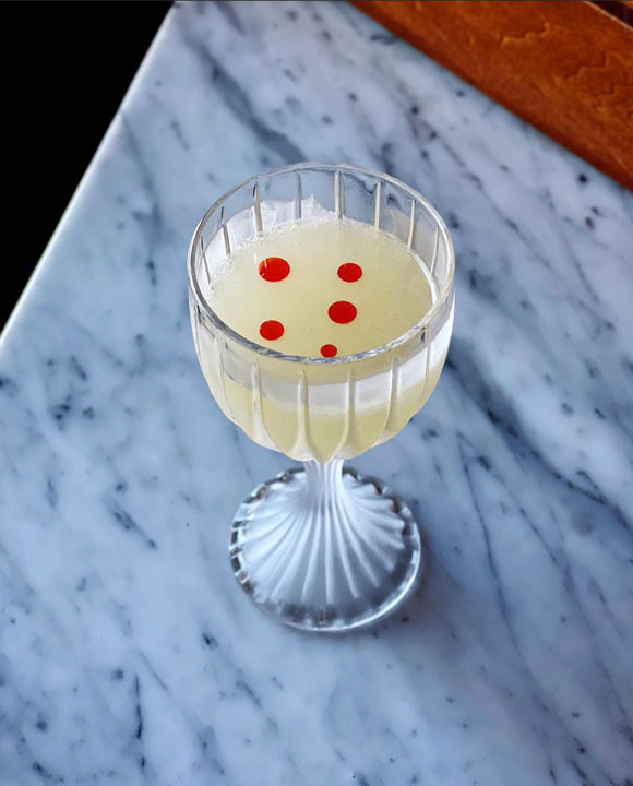 Cocktail on marble table at Kimball House