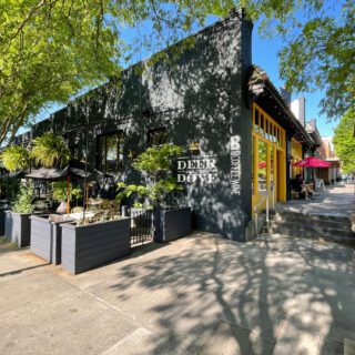 Deer and the Dove restaurant exterior with shady sidewalk patio