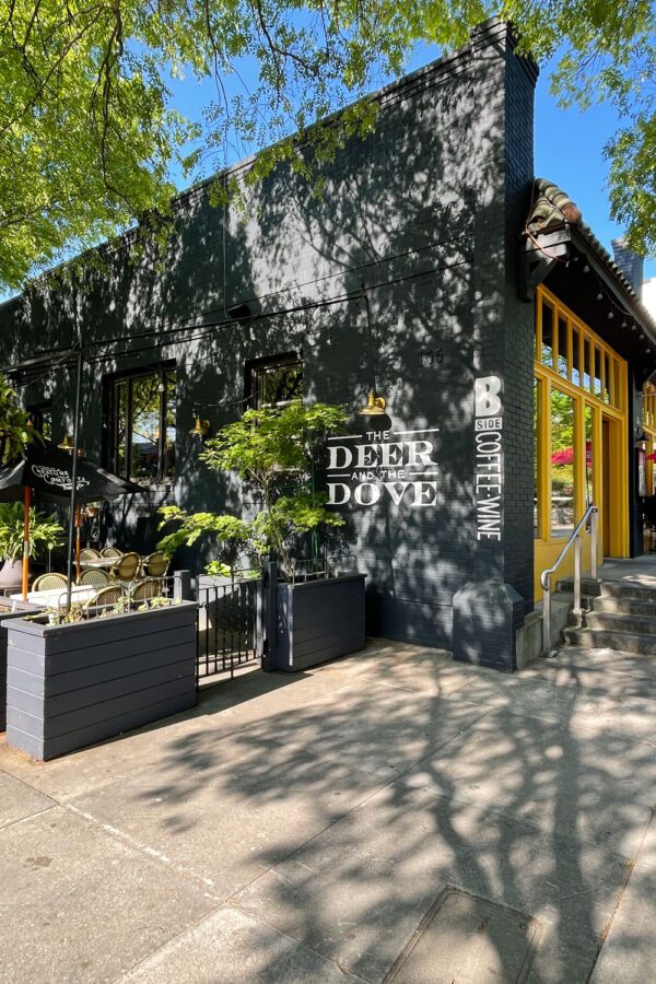 Deer and the Dove restaurant exterior with shady sidewalk patio