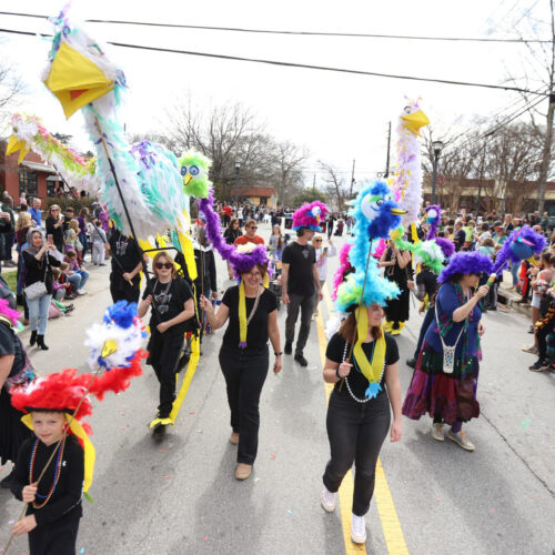 Large bird puppets at Mardi Gras Parade in Oakhurst neighborhood