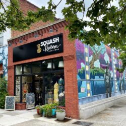 Squash Blossom Boutique Exterior With Mural On Side