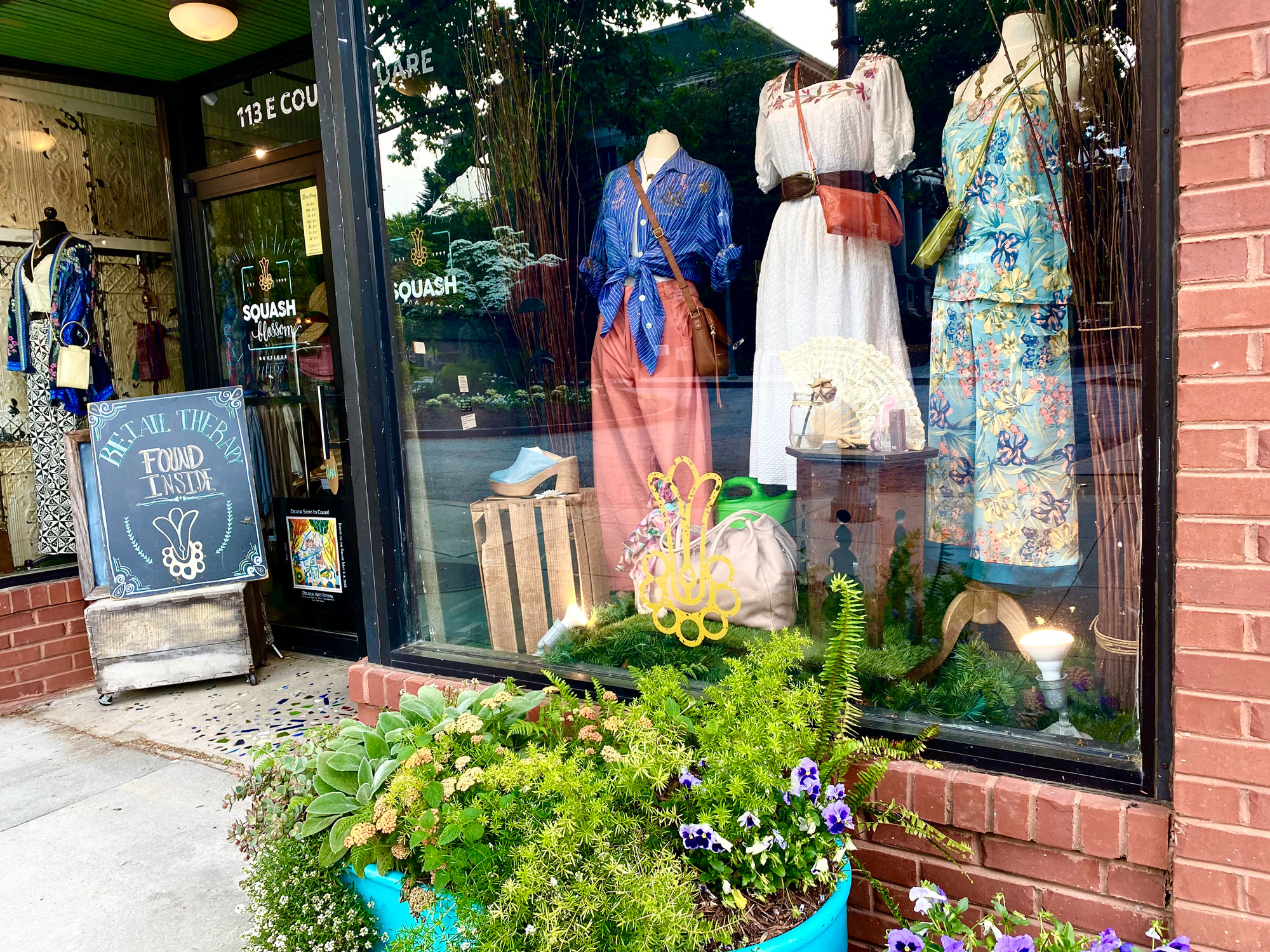 window display of women's clothing at Squash Blossom