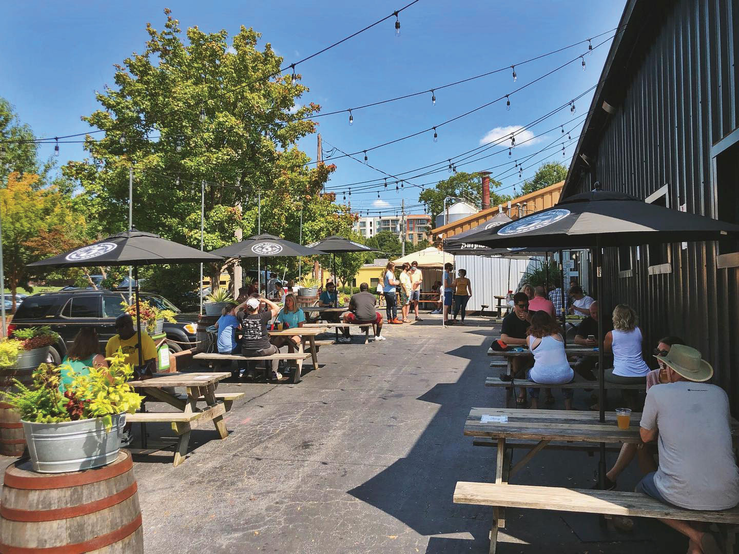 outdoor picnic table seating at Three Taverns Brewery